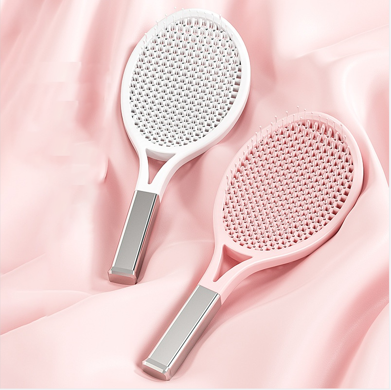 White and pink hair brushes designed for curly hair