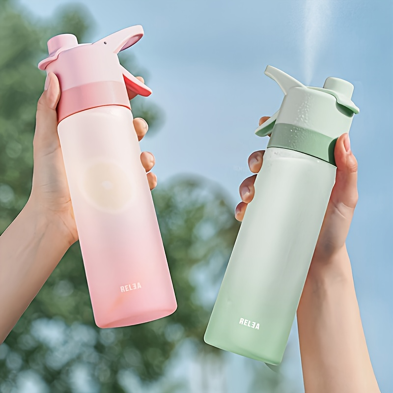 pink and green misting water bottle for sports and outdoor activities