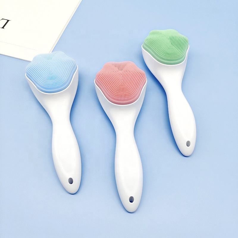 Blue, green, and pink handheld silicone face scrubber exfoliators