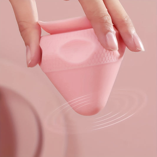 Hand holding a pink Muscle Up Training Massage Ball