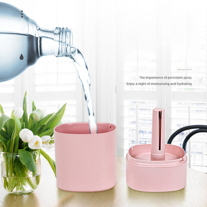 Pink USB Desktop Humidifier with LED Night Light being filled with water
