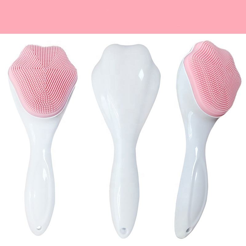 Pink handheld silicone face scrubber exfoliator shown from the front, side, and back views